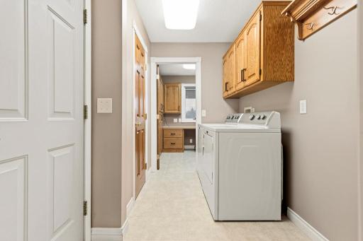 Main floor laundry room just inside the attached garage
