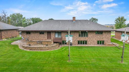 The back of the home is equally impressive with a relaxing patio overlooking the peaceful backyard