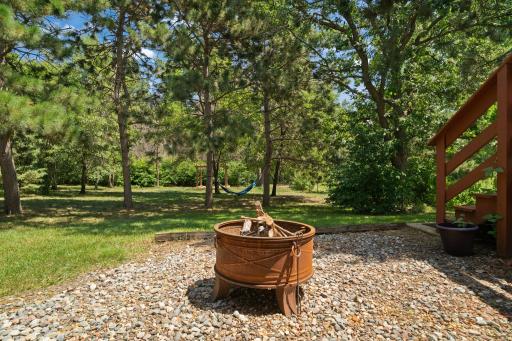 Gather around the backyard firepit and enjoy peaceful evenings.
