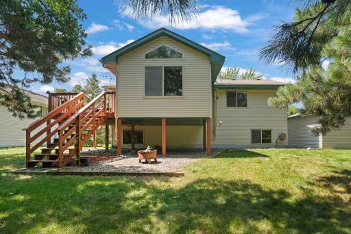 Gather around the backyard firepit and enjoy peaceful evenings surrounded by mature trees.