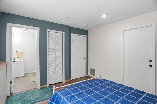 The lower-level ensuite offers a private bathroom, closet space, and a flexible layout ideal for guests or extended stays.