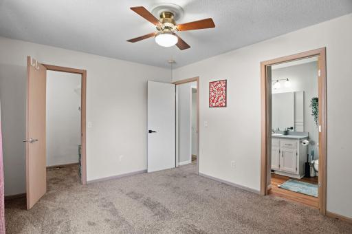 The primary suite offers a private bathroom and a generous walk-in closet.