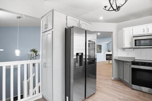 The spacious kitchen offers abundant cabinetry, updated appliances, and a functional layout for everyday cooking.
