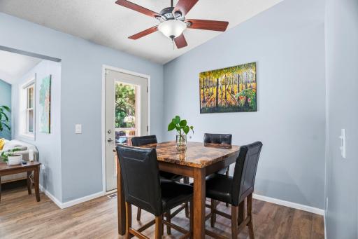 A bright dining area with direct deck access, perfect for meals, conversation, and entertaining.