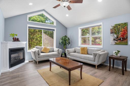 Relax beside the fireplace while enjoying peaceful views of the surrounding greenery.