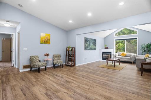 The open main-level living space offers updated flooring, abundant natural light, and plenty of room to gather.