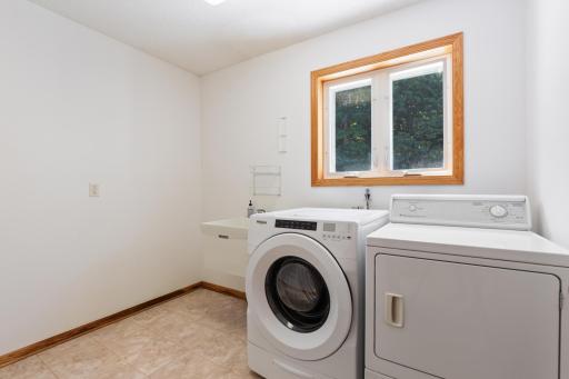 Main Floor Laundry Room | Access to 3-car garage from Backhall