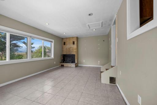 Sun Room / Den With Wood Burning Fireplace