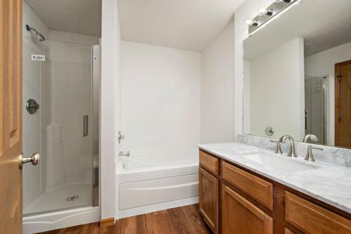 Upper full bathroom with separate tub and shower