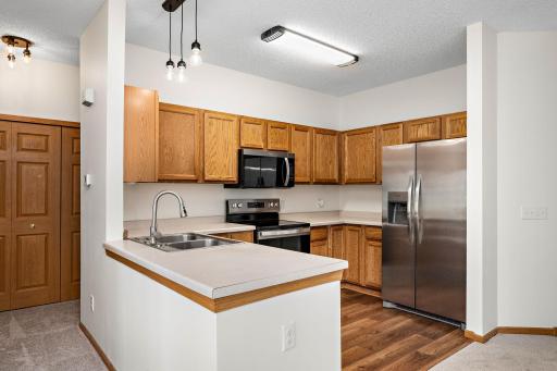 Open kitchen with stainless steel appliances