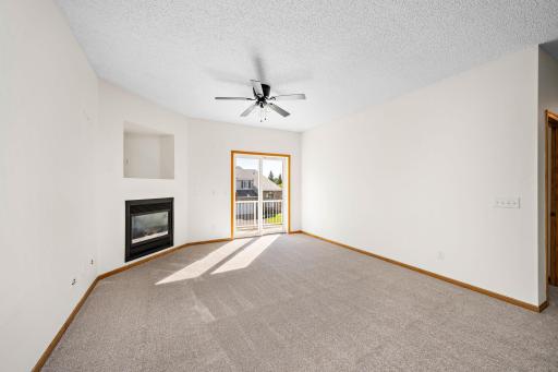 Main floor living room with high ceilings and access to the deck