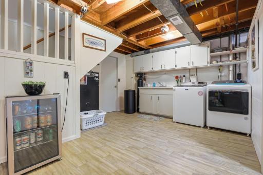 Laundry in the lower level, behind that door on the left is more storage