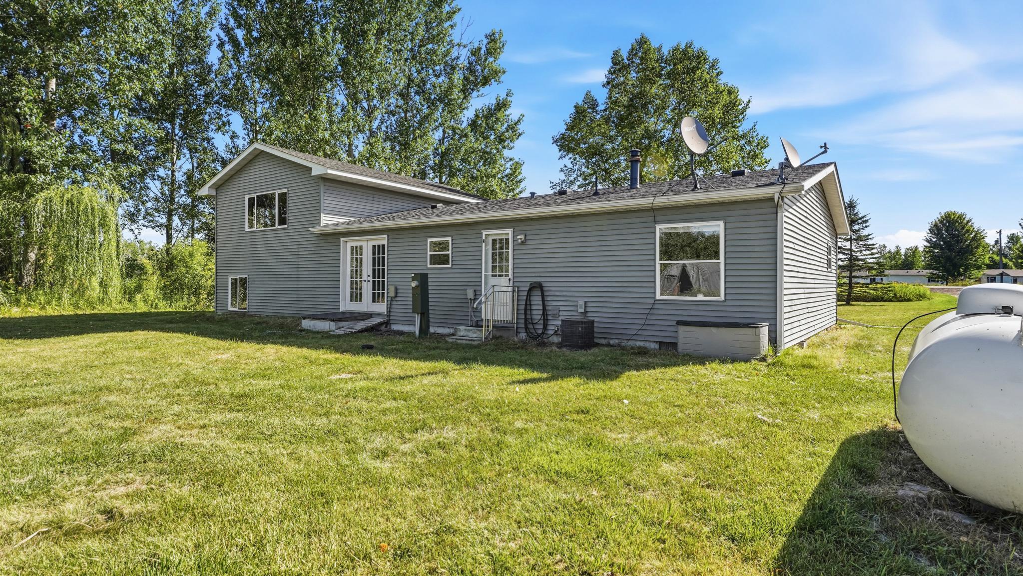 Kitchen & dining rooms lead to backyard
