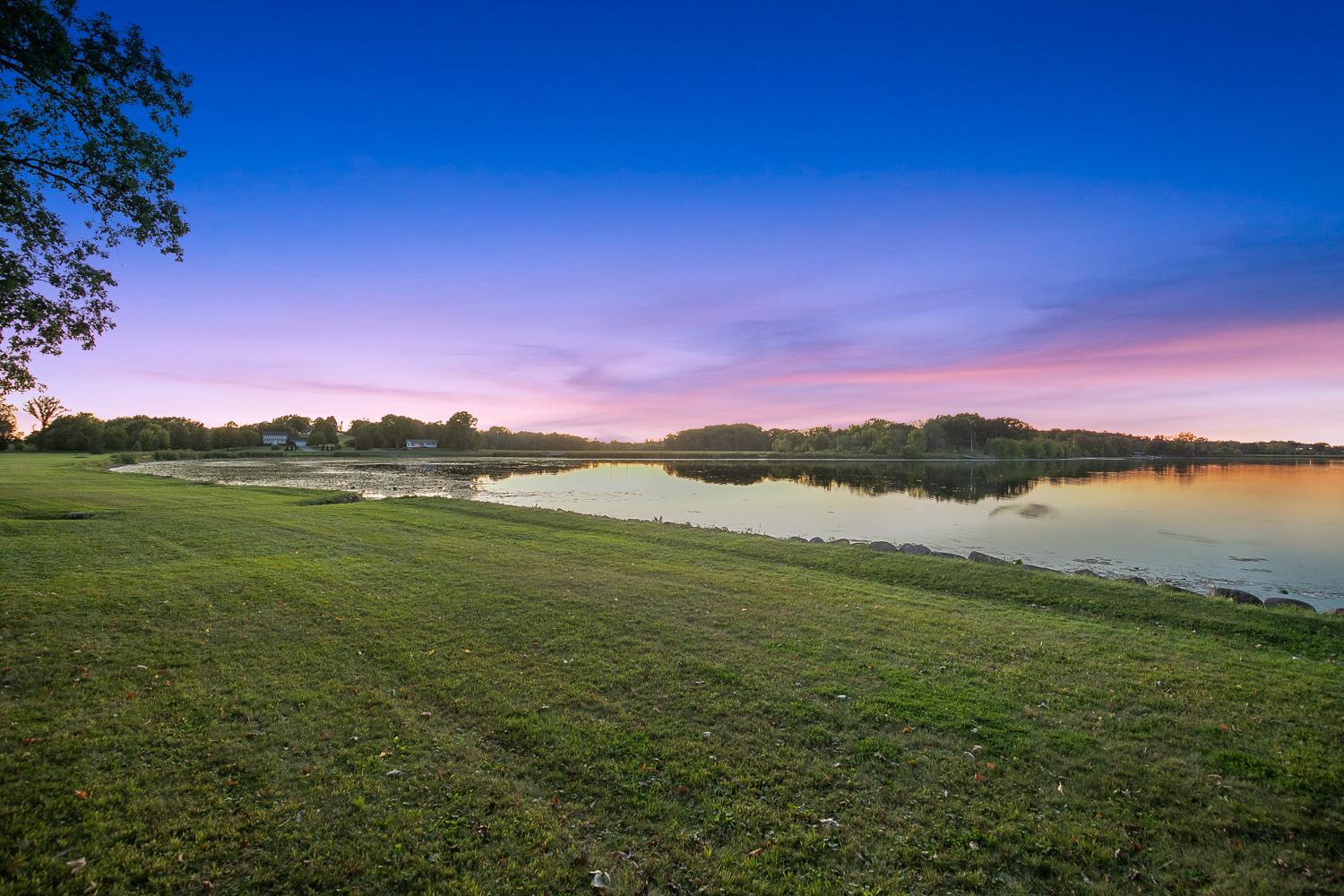Watch the sunset over Lake Independence from your own backyard.