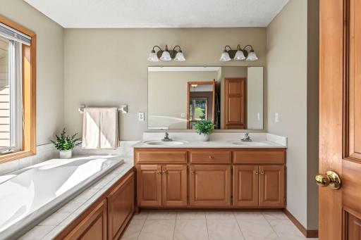 Primary bath with double sinks and jetted tub.