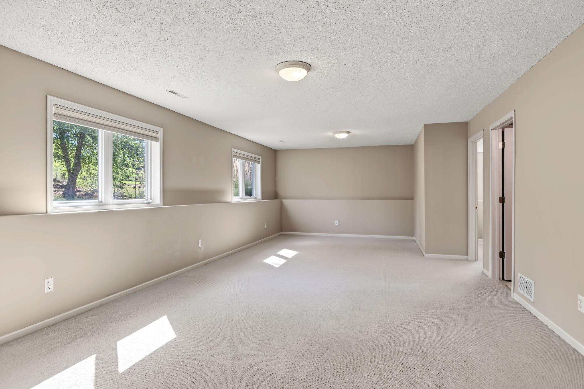 Light, bright and spacious family room offering plenty of room to relax, gather and entertain.