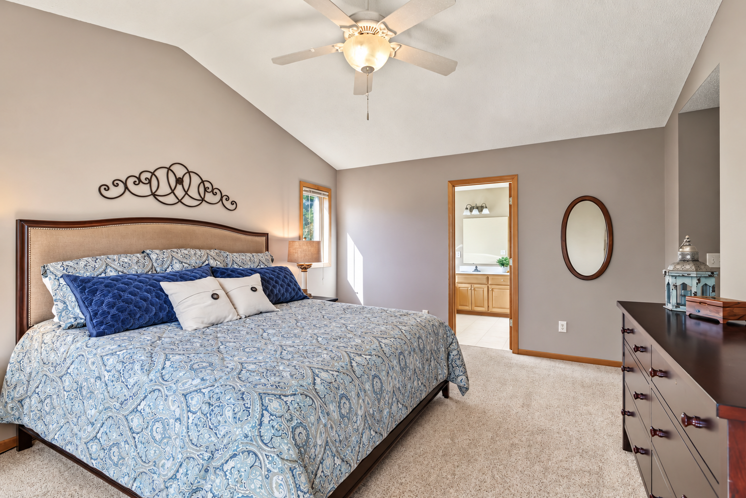 Another view of the primary bedroom showing entrance to the private full bath. There is also a large walk-in closet.