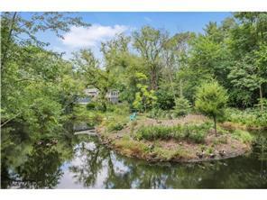 Pond and trail on property