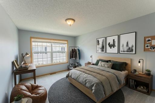 VIRTUALLY STAGED. The 3rd Bedroom shown as a guest room.