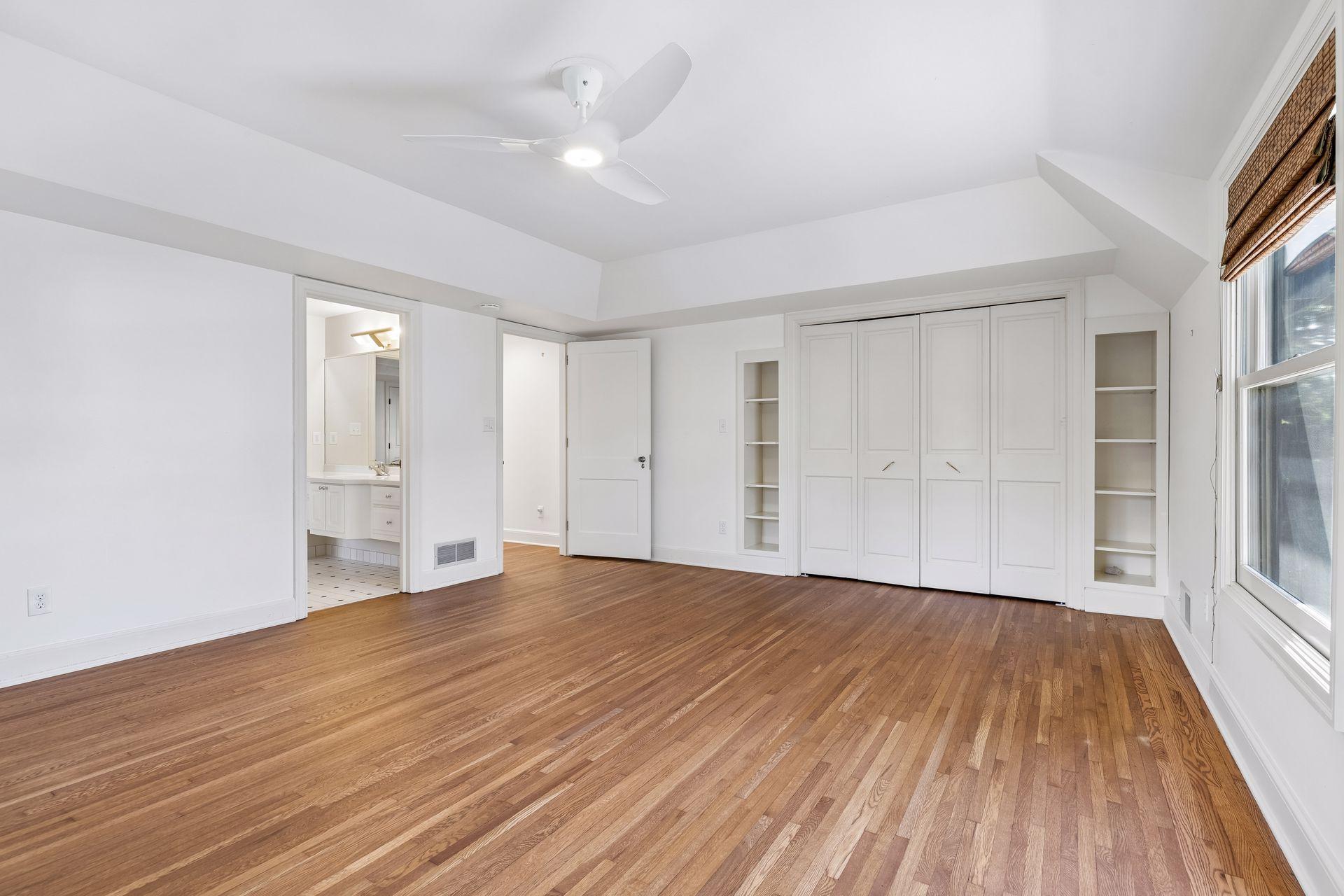 The second and third bedrooms share a Jack and Jill closet. The second bedroom features a double door closet and built-in library shelving.