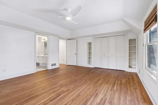 The second and third bedrooms share a Jack and Jill closet. The second bedroom features a double door closet and built-in library shelving.