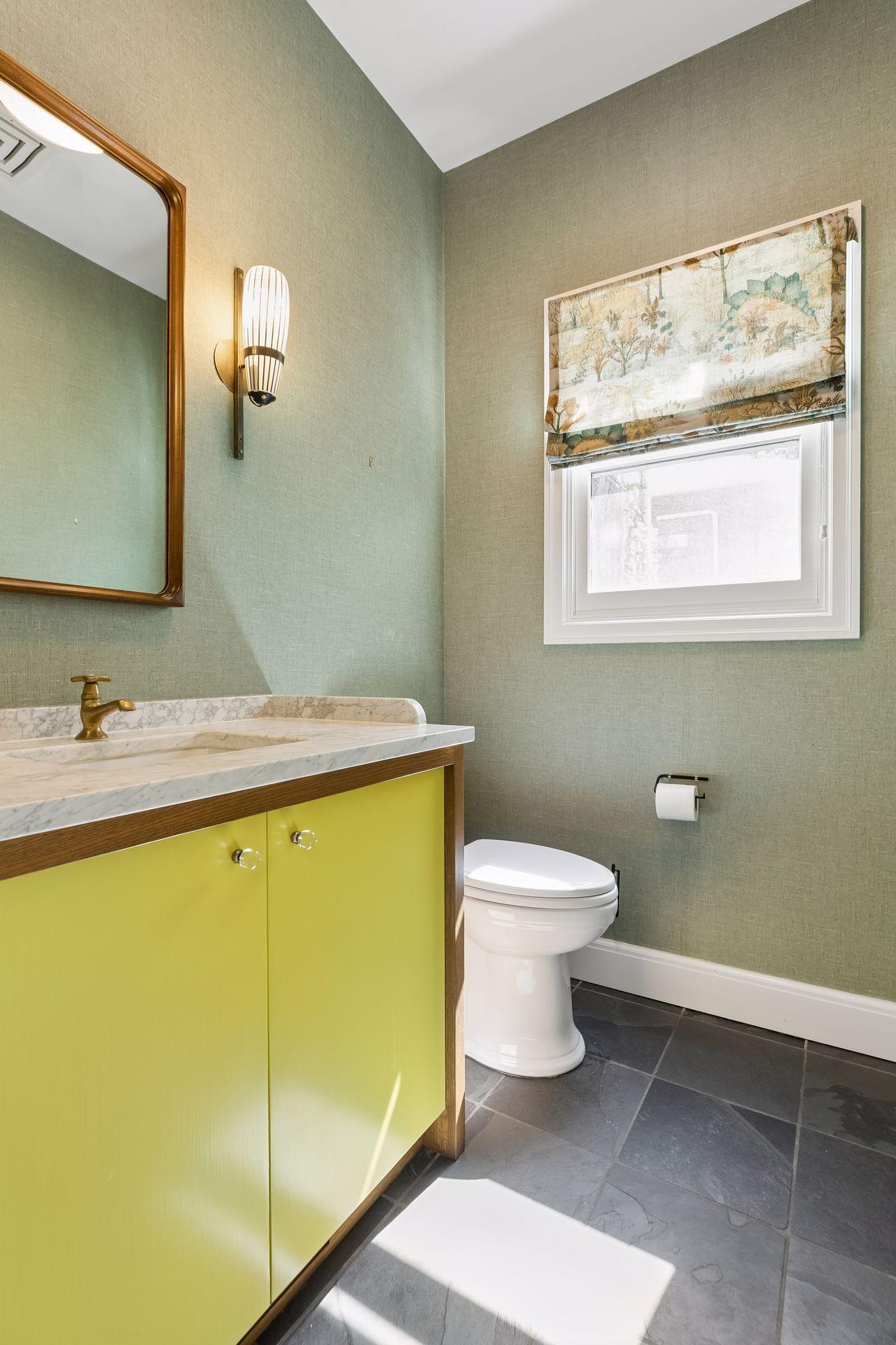 This powder room is adjacent to the mudroom. A second powder room is located off of the front entry hall.