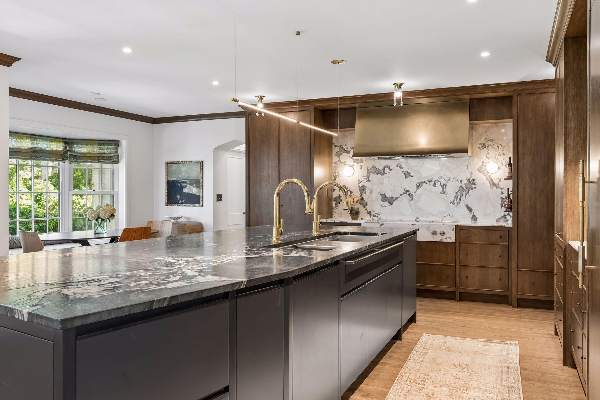 The gourmet kitchen meets the expectation of space, function, style, quality of finishes, and beauty.