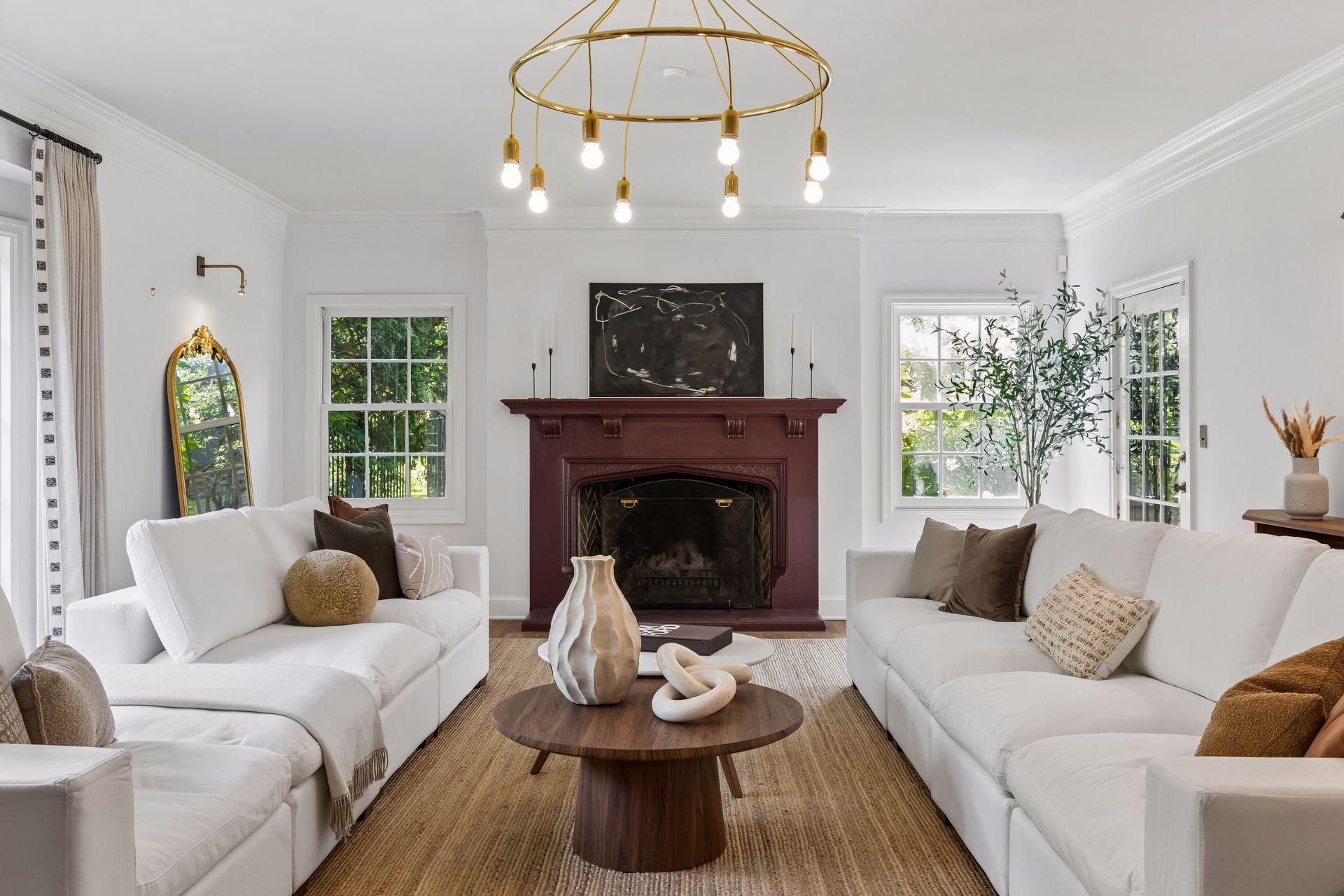 Formal living room with wood-burning fireplace and direct access to yard.