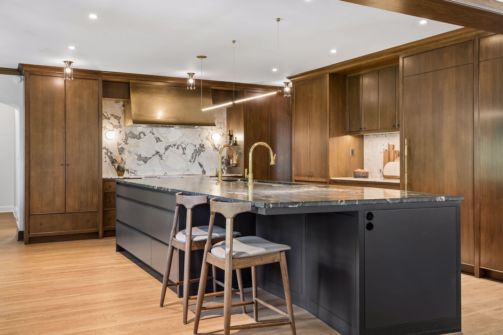 Stunning kitchen renovation with integrated luxury appliances behind cabinets, separate fridge/freezer, two beverage drawers, two dishwashers, 5' sink with dual faucets, oversized island, exhaust hood over a luxury cooktop with teppanyaki grill.