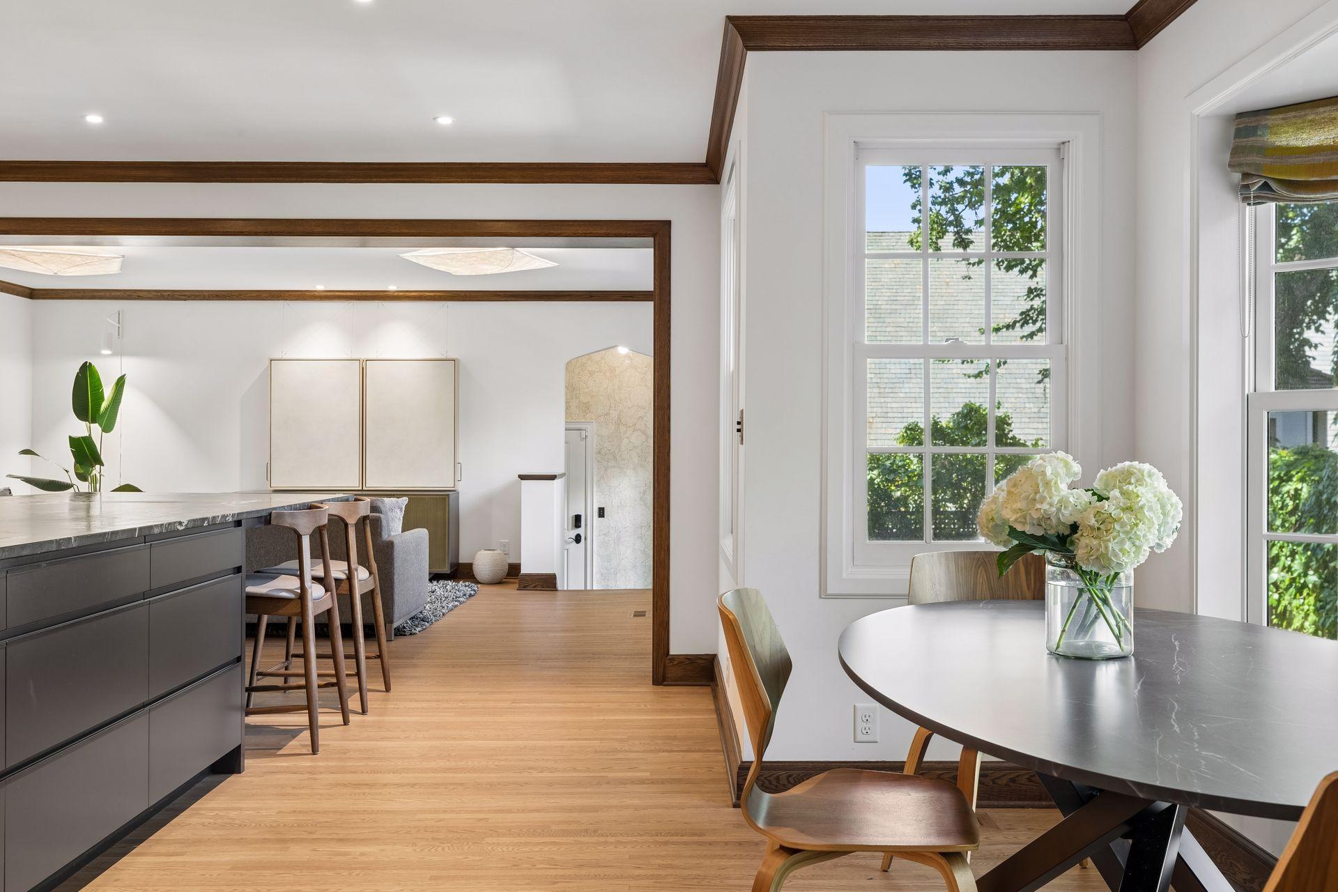 The heart of the home invites lingering around the kitchen table and oversized island. An ideal setting for breakfasts, informal gatherings, entertaining, and cooking together in the gourmet kitchen.