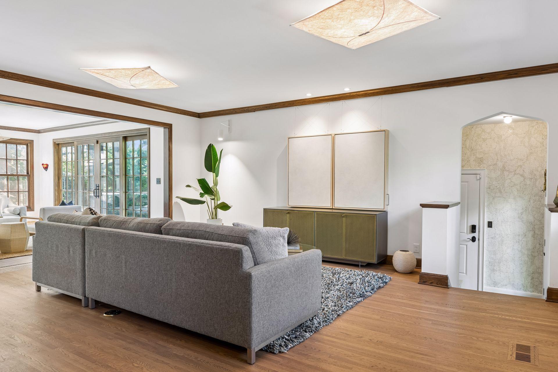 The main level family room and kitchen are conveniently adjacent to the mudroom, powder room, and garage entry and side-door access. This floor plan provides for easy and gracious daily living.