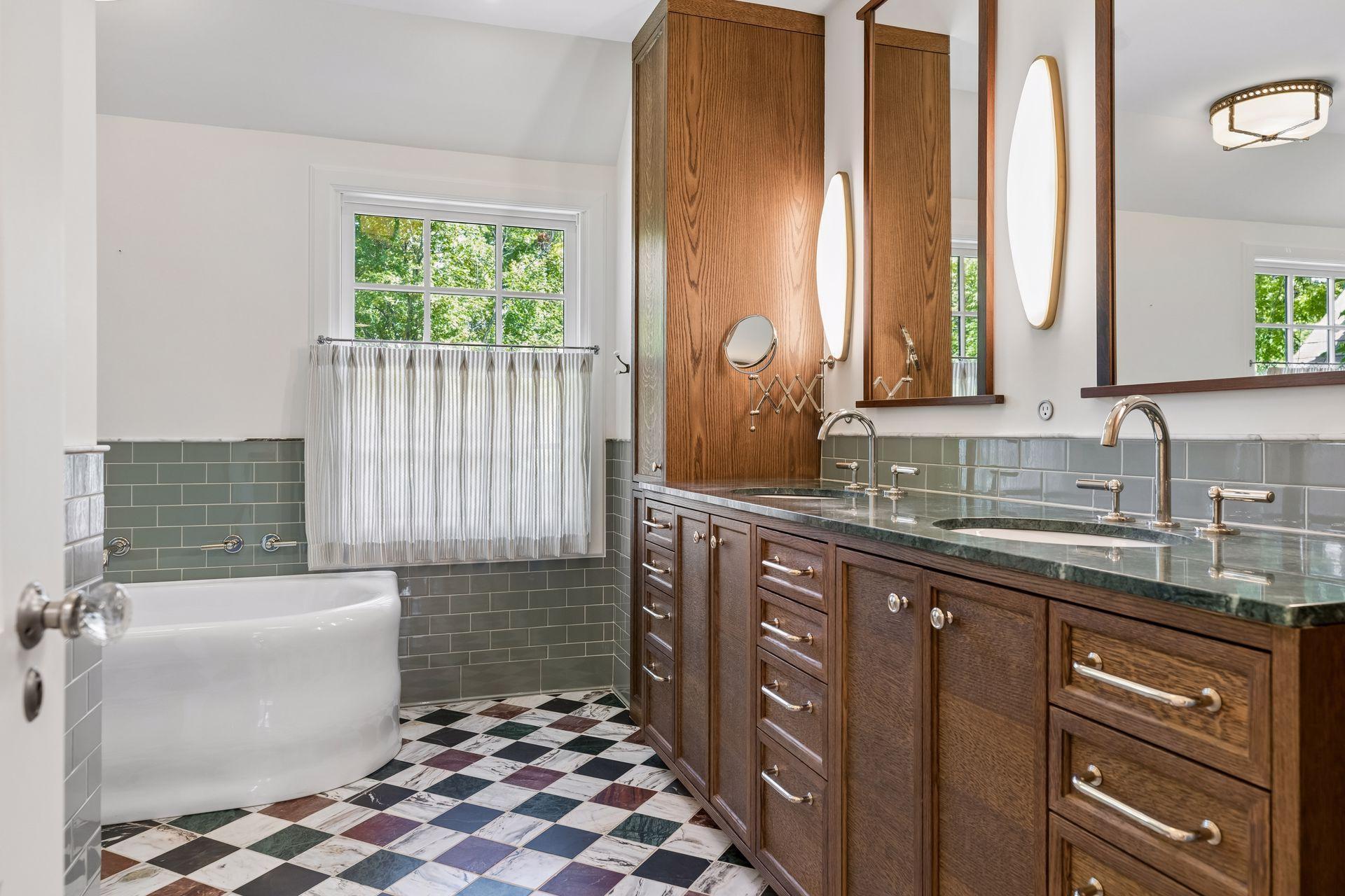 Primary bath with excellent mirror image storage for each vanity.