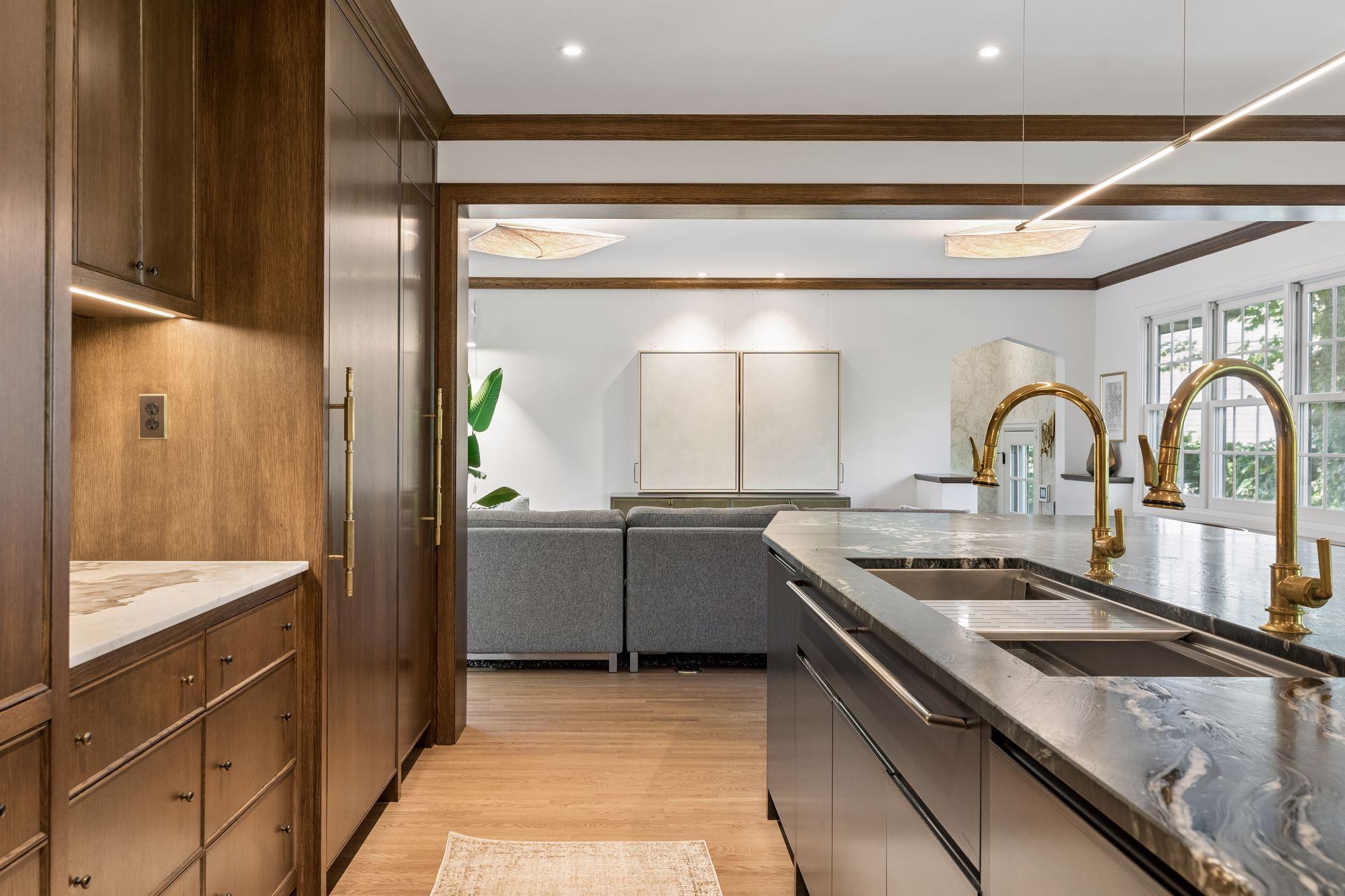 The kitchen is open to the adjacent family room, sunroom with direct access to the patio and yard.