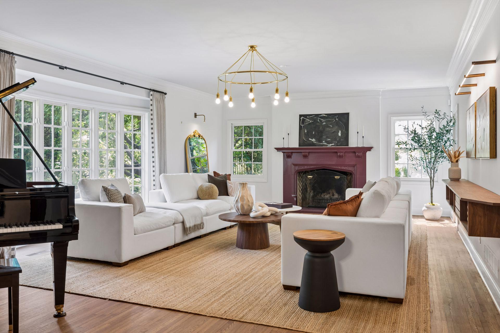 Spacious formal living room with beautiful east-facing bay windows. Southern and east-facing windows bring in lovely natural light.