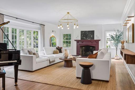 Spacious formal living room with beautiful east-facing bay windows. Southern and east-facing windows bring in lovely natural light.