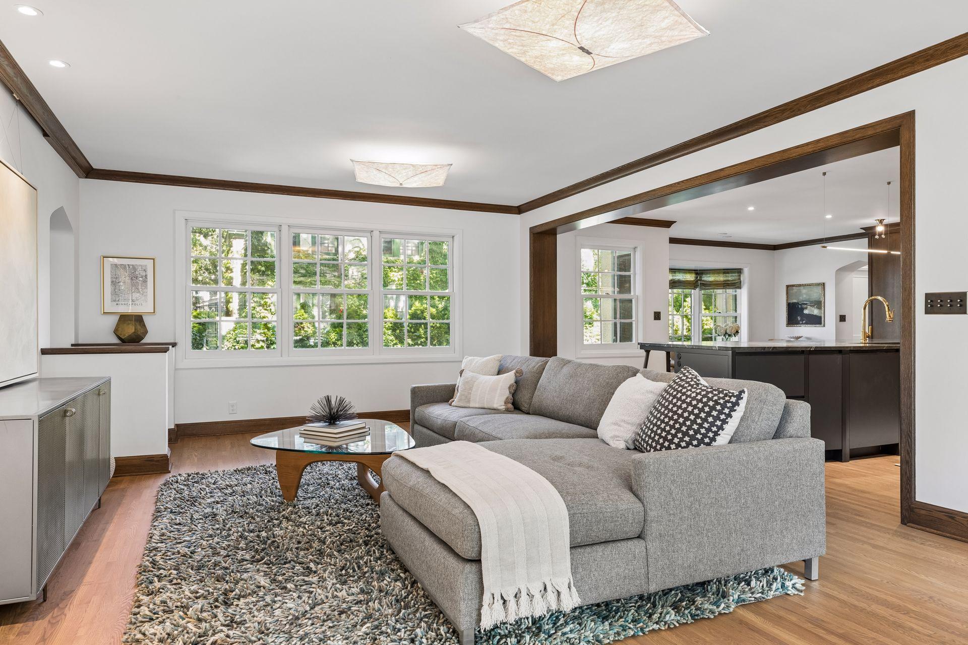 Main level family room and view into the kitchen from the sunroom.