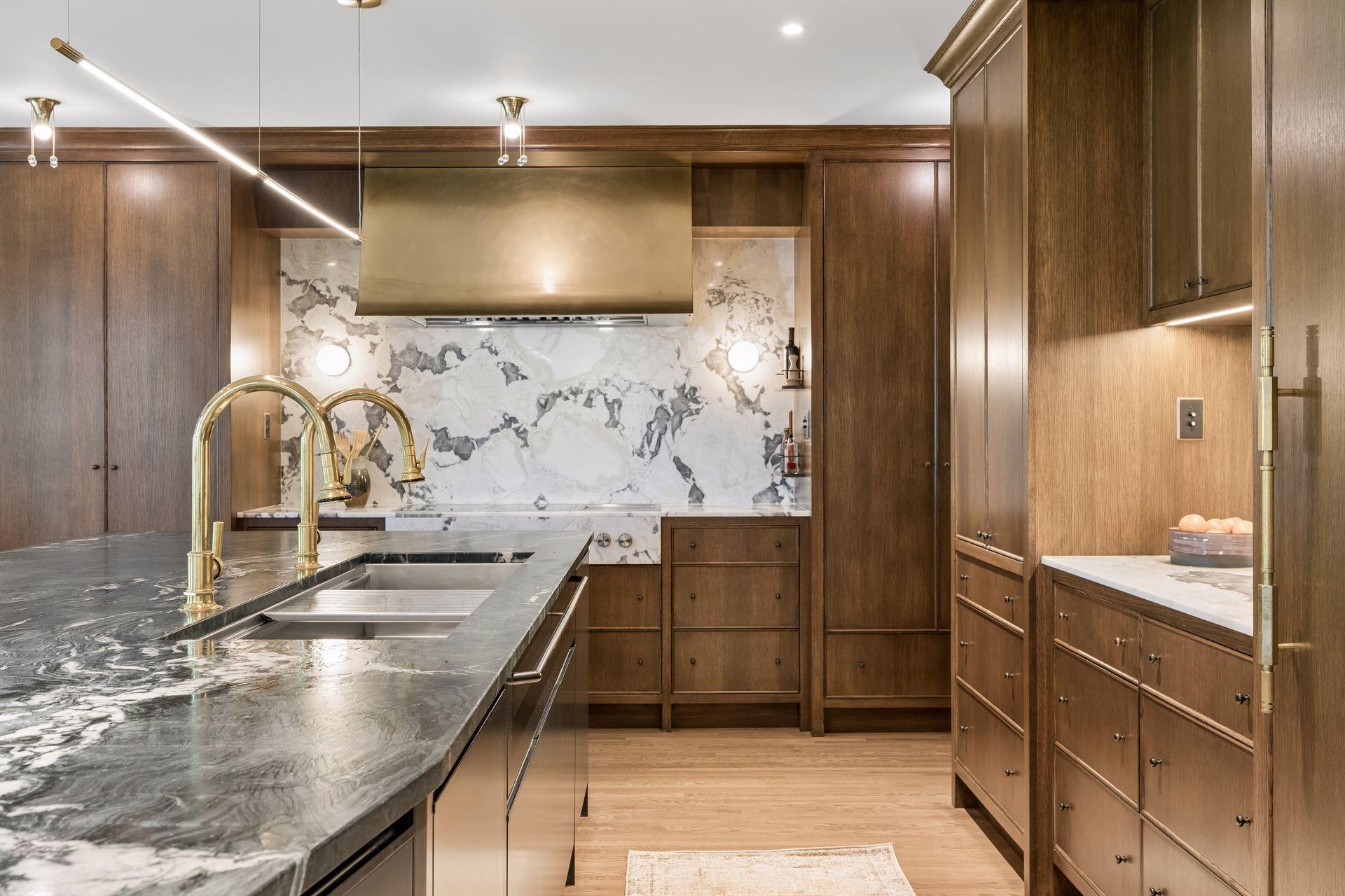 Beautiful oyster marble counters and backsplash with a durable and stylish Krypton Quartzite center island.