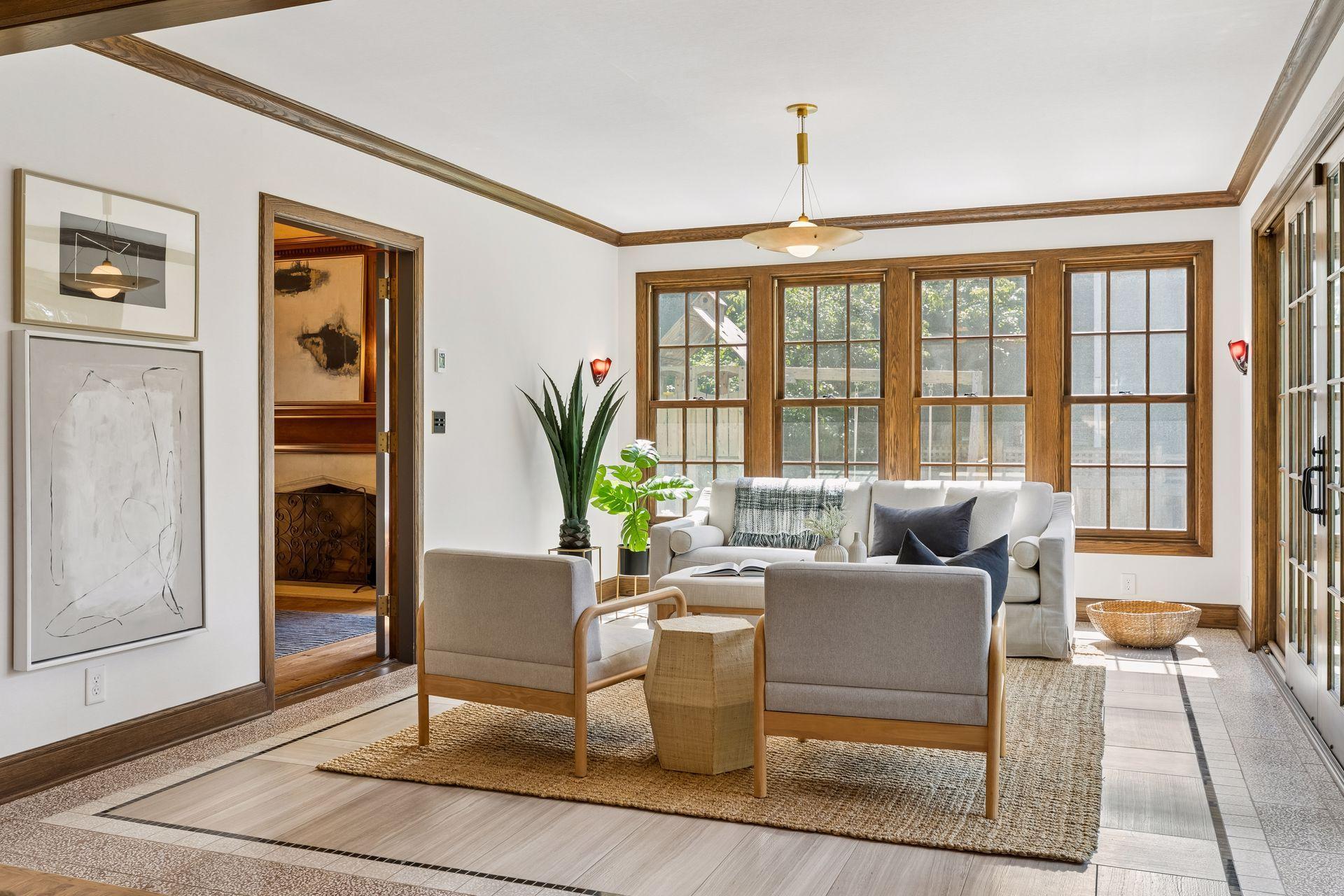 The sunny and bright sunroom features heated tile and terrazzo floors, lovely views of the yard and direct access through French sliding doors to the patio. An inviting space for every living thing!