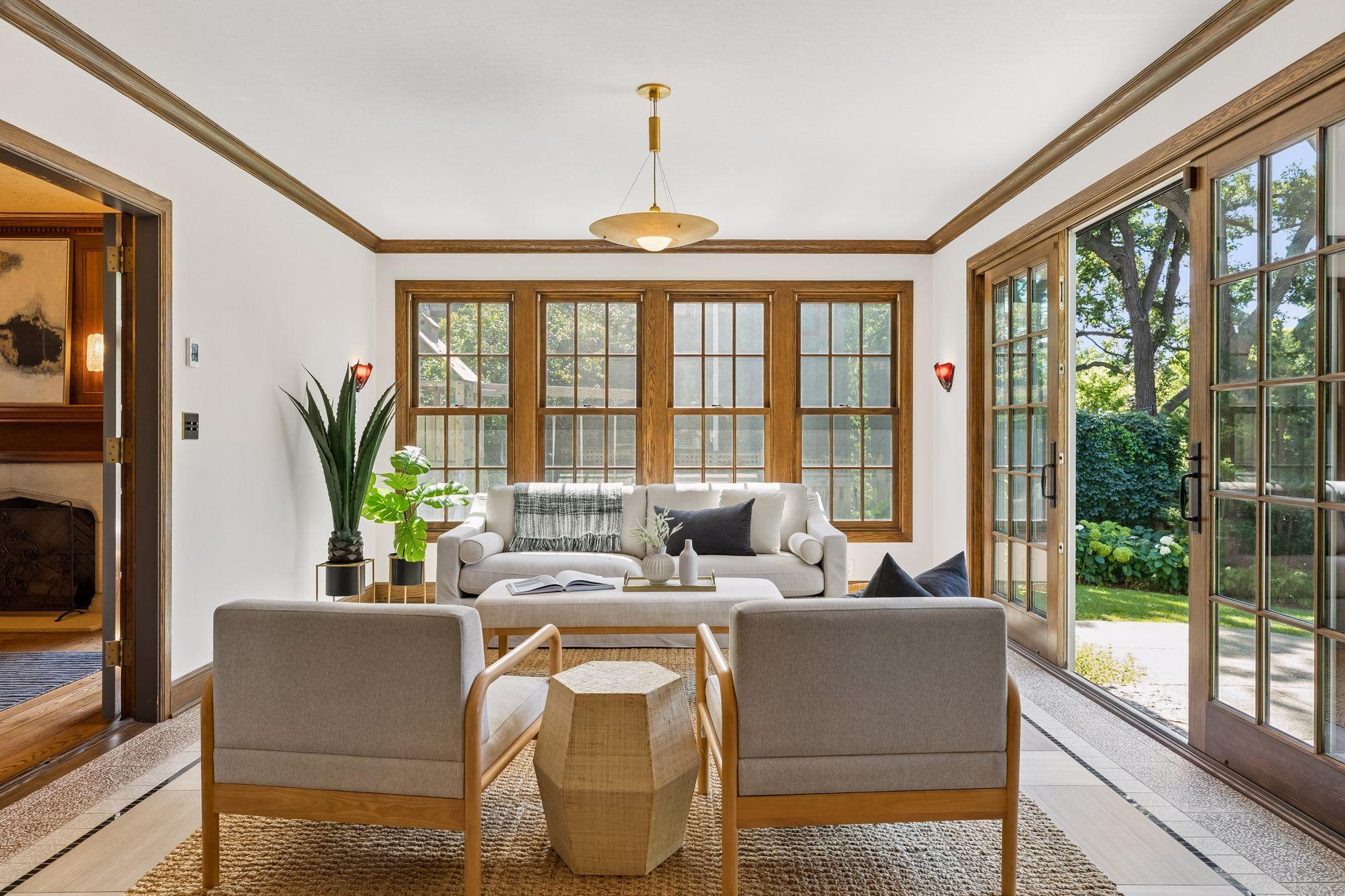 Beautiful garden views and access to the outdoors from the sunroom with sightlines from the kitchen, dining room, and family room.