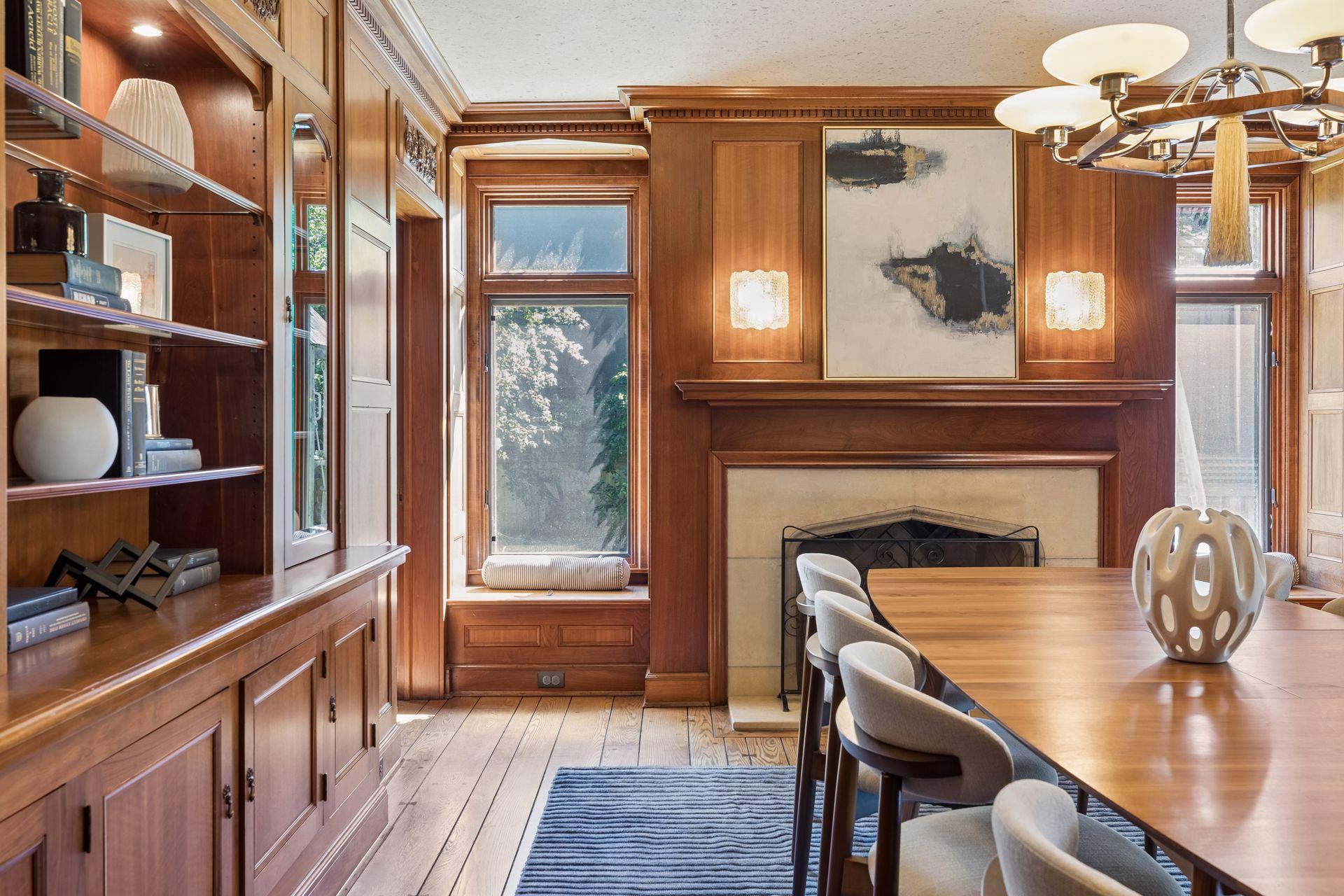 Pristine mill work decorates the formal dining room. Beautiful south-facing windows and window seats.