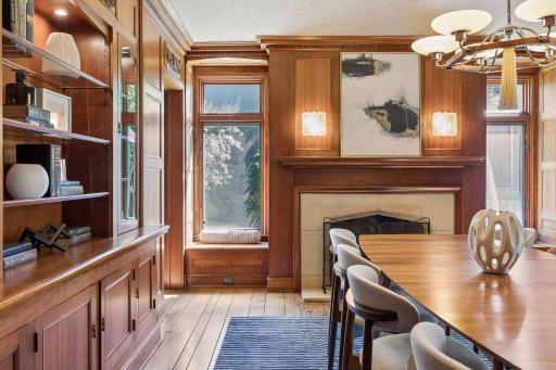 Pristine mill work decorates the formal dining room. Beautiful south-facing windows and window seats.