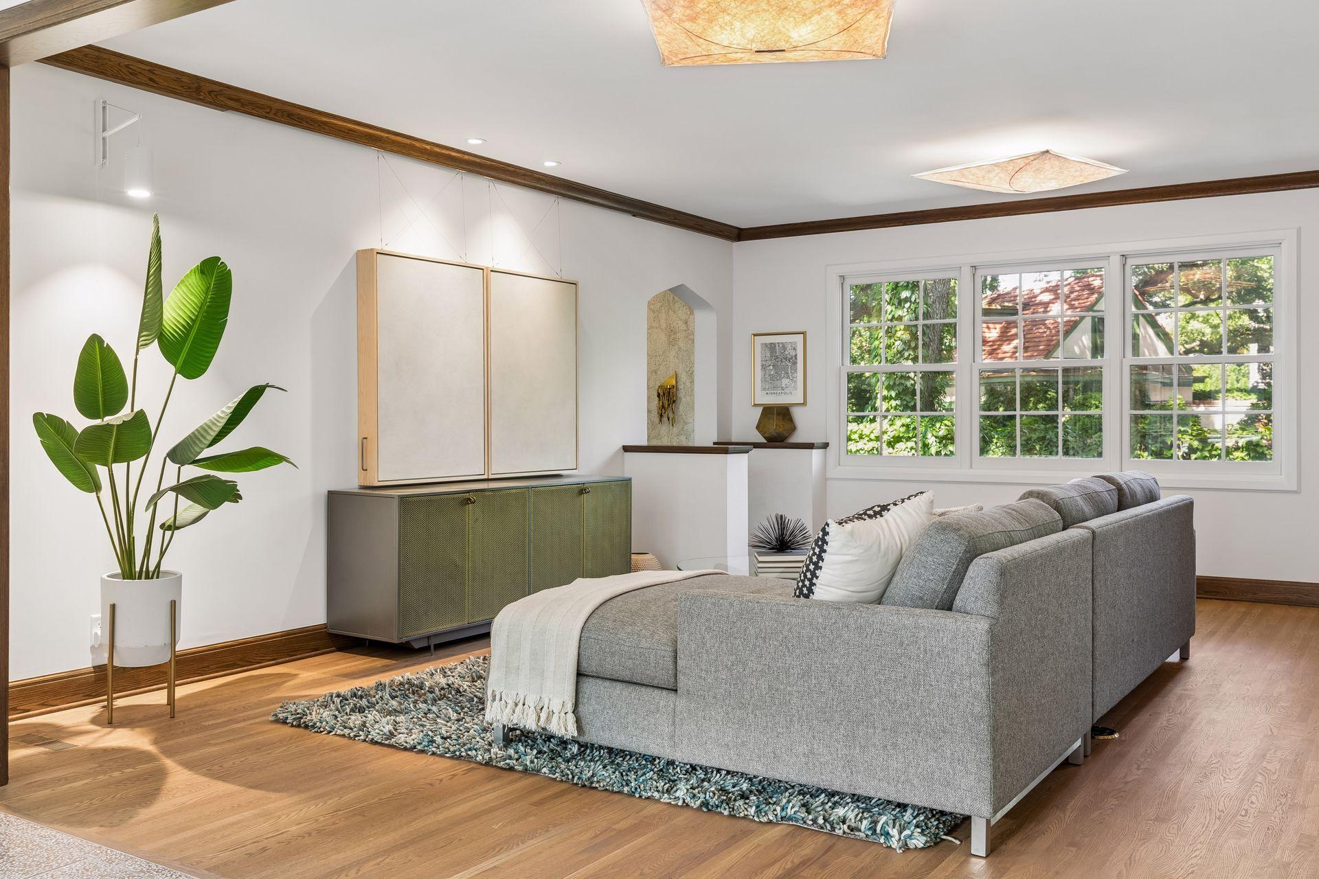 Two custom painting panels were designed to conceal the television. They slide apart on a smooth track for morning news, movie nights, and game days!
