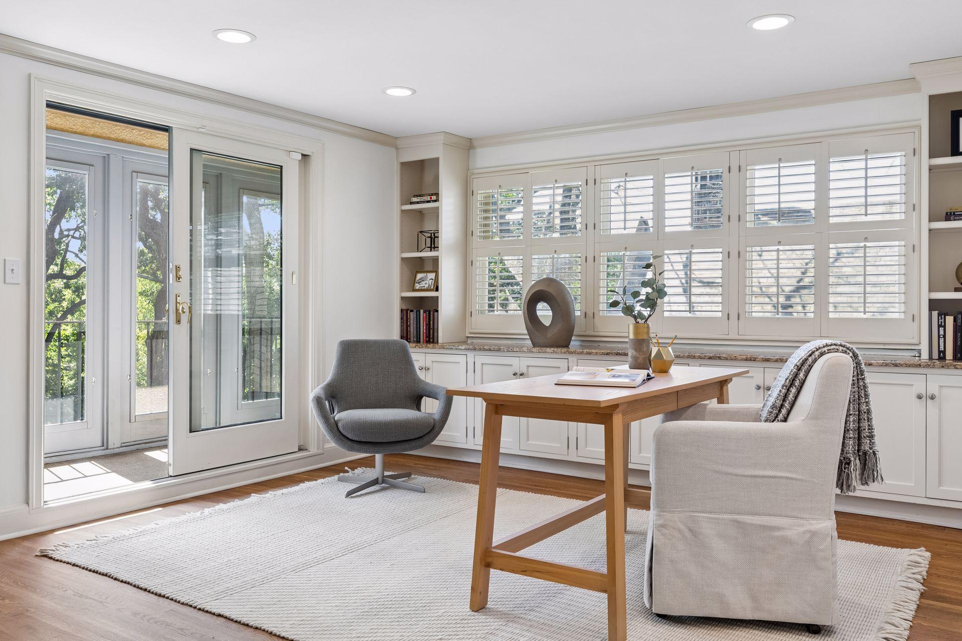Primary suite office area with three-season porch.