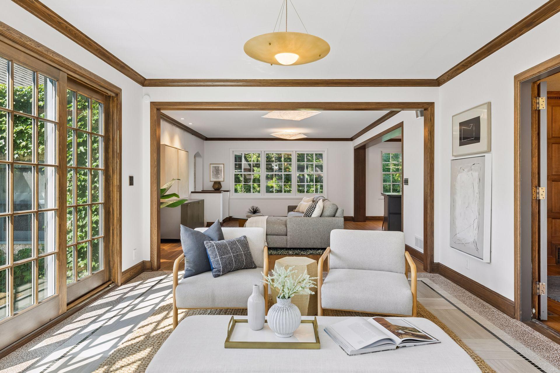 Sunroom with view towards the family room and kitchen.