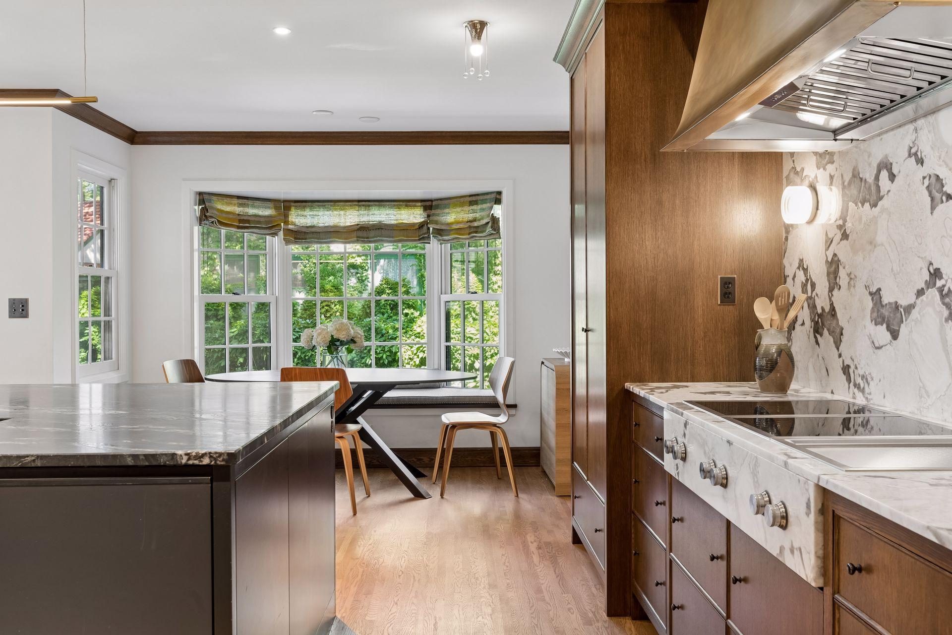 Kitchen views and an inviting breakfast table with built-in cushioned window seats.