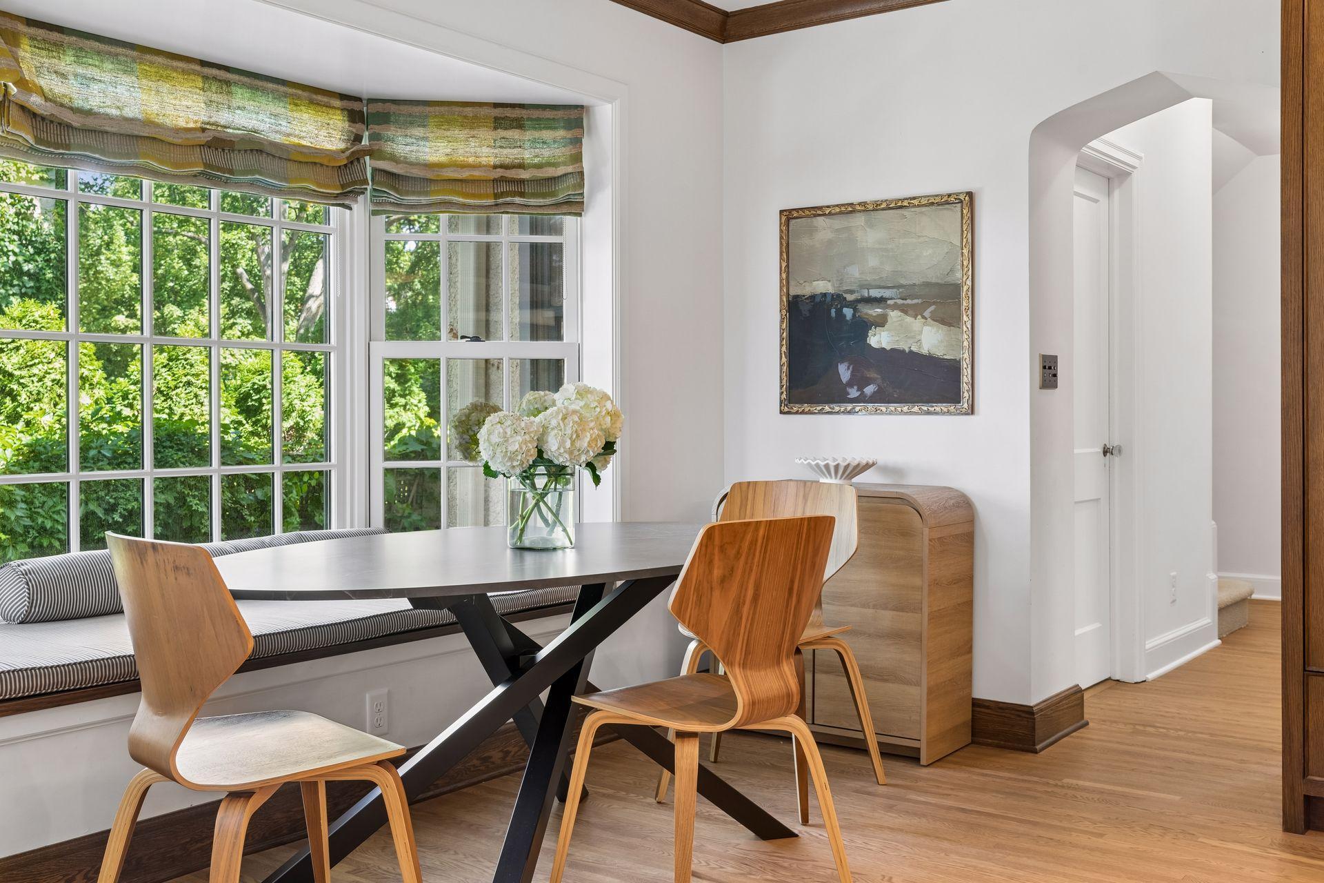 Kitchen breakfast area with bay window seating.