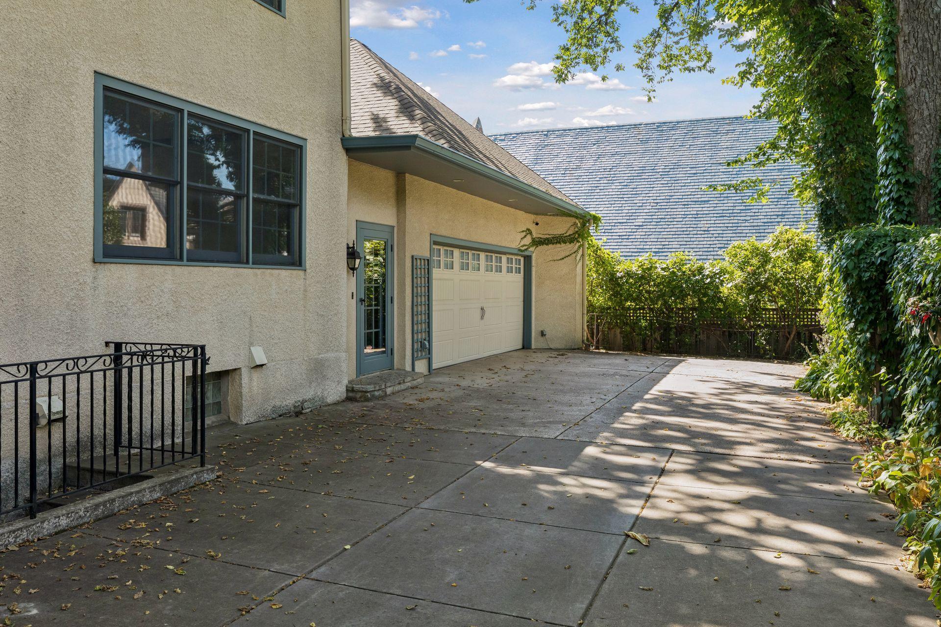 A wide private driveway leading to the side door entrance into the mudroom and a spacious 2.5 car attached garage. Enjoy easy coming and going, a nice hardscape for bikes and play, privacy and security with a perimeter fence.