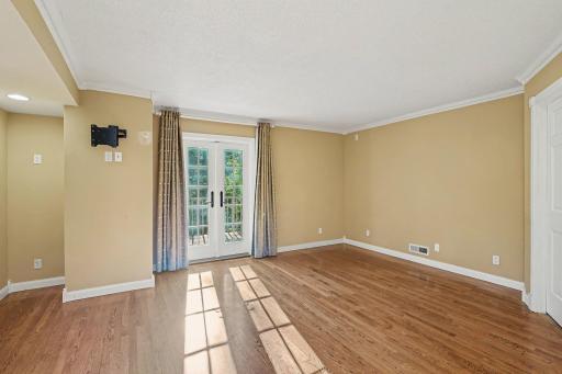 Primary bedroom with French doors leading to private deck