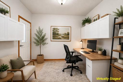 Flex room with built in shelves and door to added storage closet