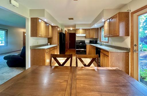 This view reveals how roomy and spacious this kitchen really is. Lots of cupboard and counter space here.